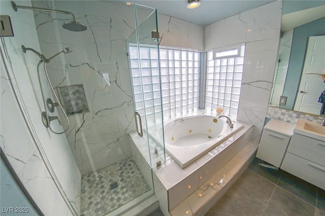 bathroom with vanity, plus walk in shower, and tile patterned flooring