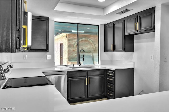 kitchen with electric range, stainless steel dishwasher, a healthy amount of sunlight, and sink