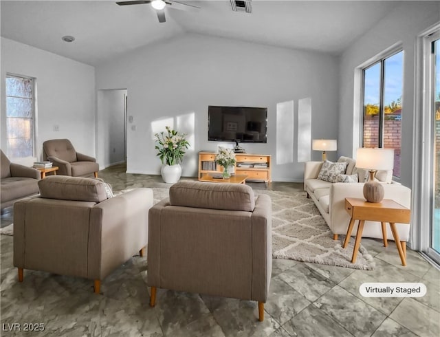 living room with ceiling fan and vaulted ceiling