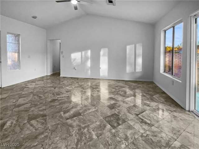 empty room featuring ceiling fan and vaulted ceiling