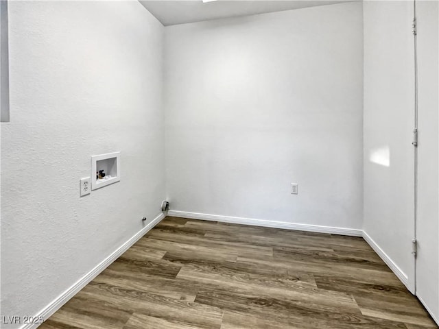 laundry room featuring dark wood-type flooring and hookup for a washing machine