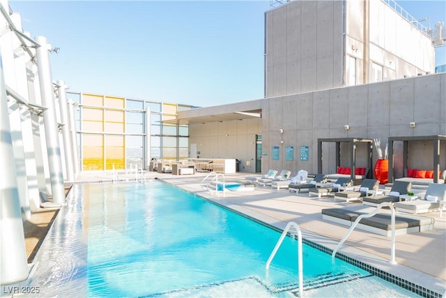 view of pool featuring a patio area