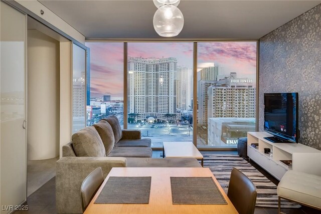 living room featuring expansive windows and tile patterned floors