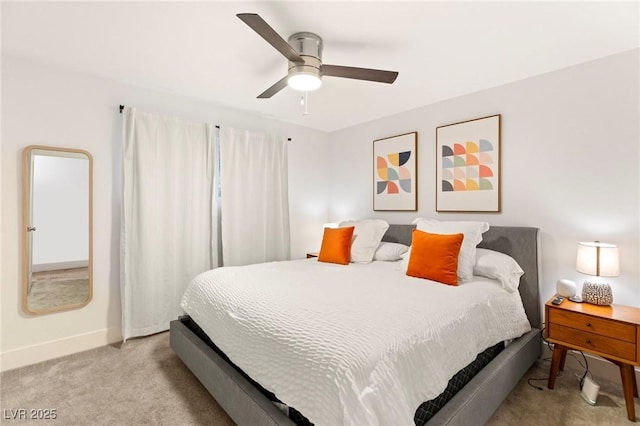 bedroom featuring light colored carpet and ceiling fan