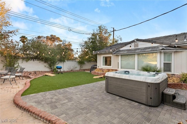 view of patio with a hot tub