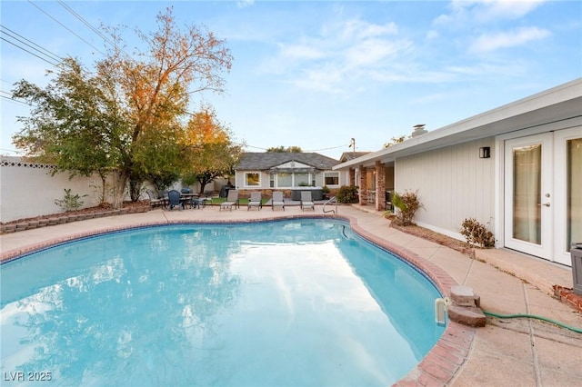 view of swimming pool featuring an outdoor structure