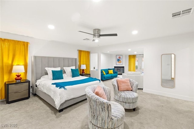 bedroom featuring ceiling fan and light carpet