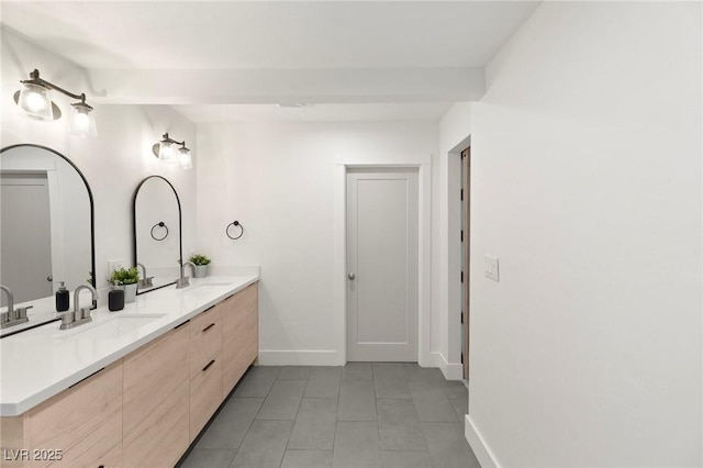 bathroom with tile patterned floors and vanity