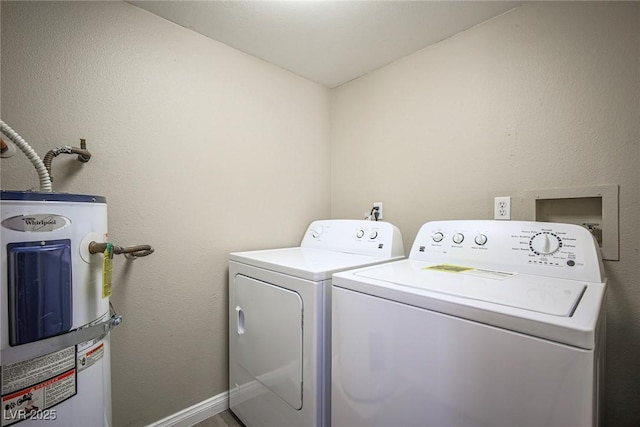 laundry room featuring independent washer and dryer and electric water heater