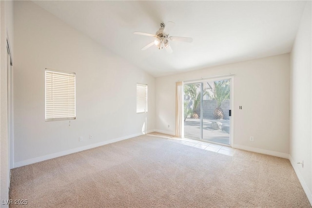 carpeted empty room with high vaulted ceiling and ceiling fan