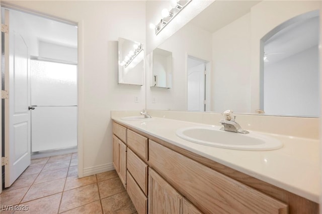 bathroom with vanity, tile patterned floors, and ceiling fan