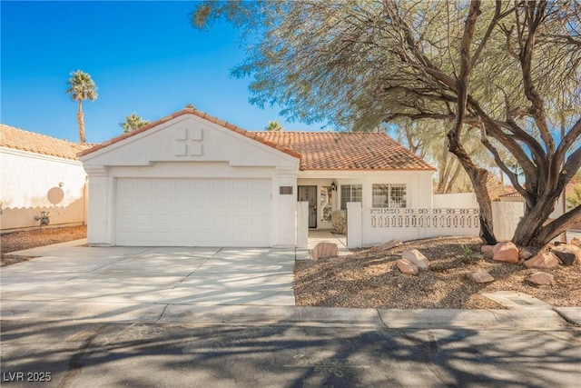 mediterranean / spanish-style house featuring a garage