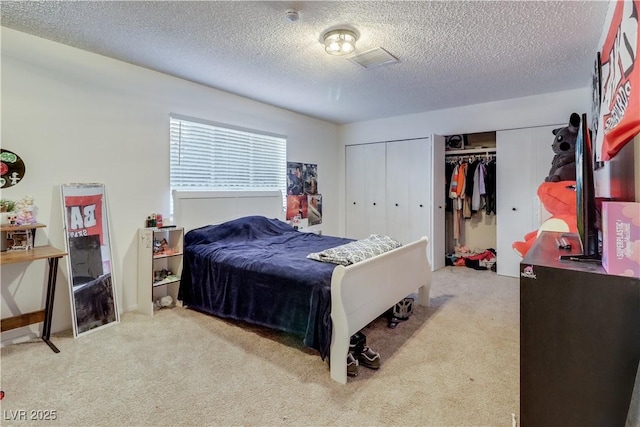 carpeted bedroom with a textured ceiling