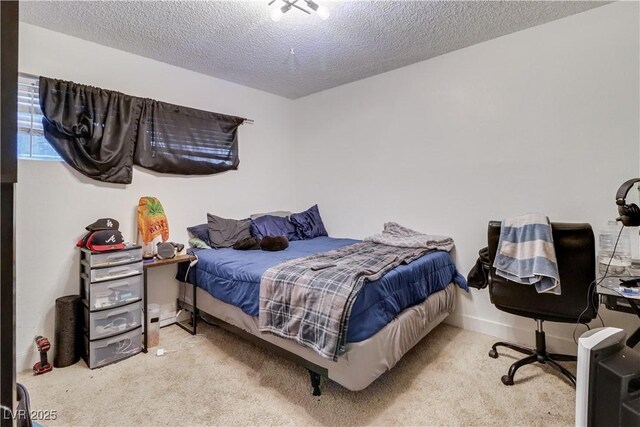 carpeted bedroom featuring a textured ceiling