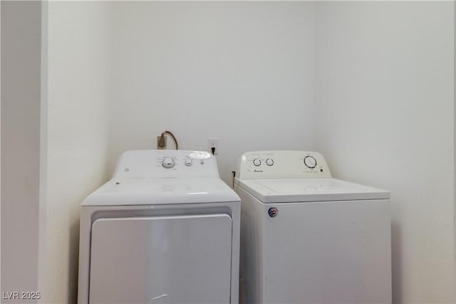 washroom featuring washer and dryer