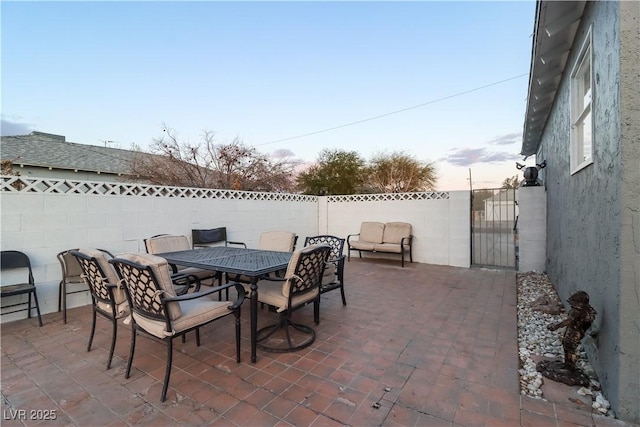 view of patio terrace at dusk