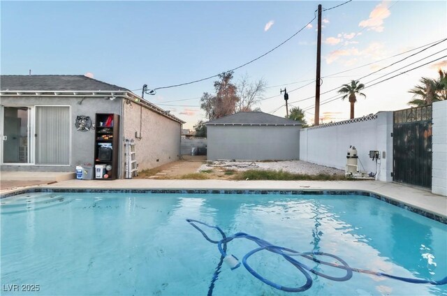 view of swimming pool with an outdoor structure