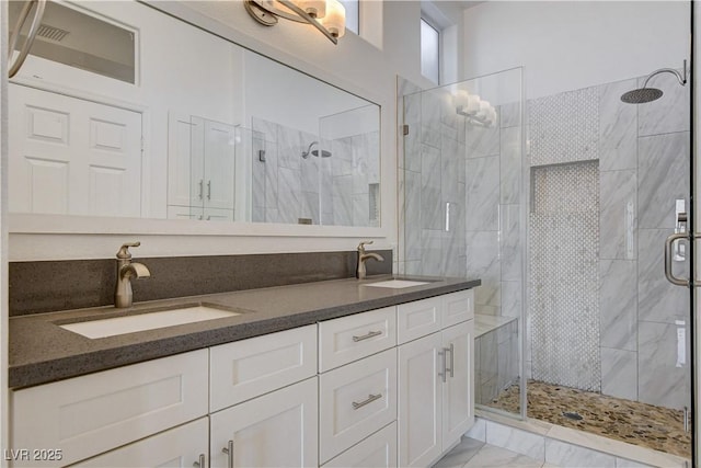 10300 Bent Brook Pl, Las Vegas, NV 89134 - bathroom with a sink, a shower stall, double vanity, and marble finish floor