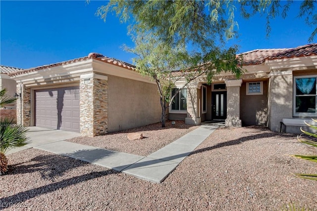 10300 Bent Brook Pl, Las Vegas, NV 89134 - view of front of property with french doors, a tile roof, an attached garage, stone siding, and stucco siding