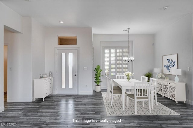 foyer featuring an inviting chandelier and dark wood-type flooring