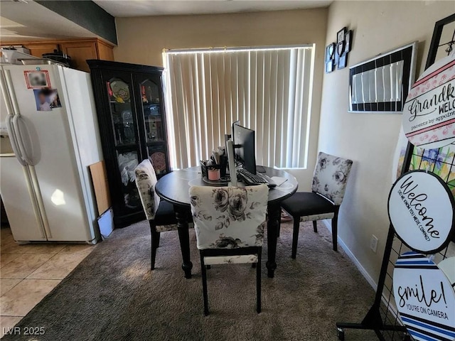 dining area with light tile patterned flooring