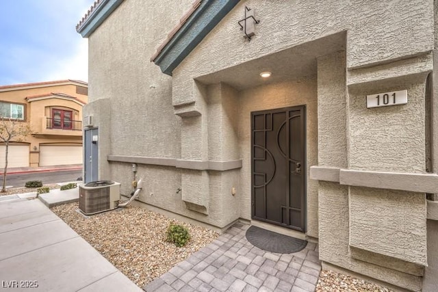 doorway to property with central air condition unit