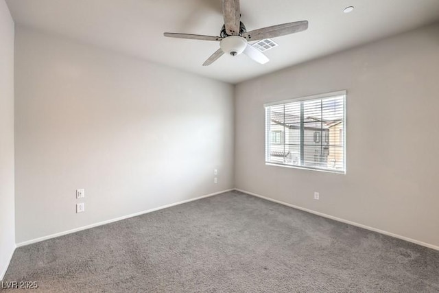 carpeted empty room featuring ceiling fan