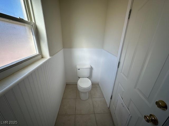 bathroom with tile patterned floors and toilet