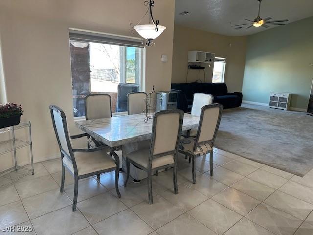 dining room featuring ceiling fan and light tile patterned floors