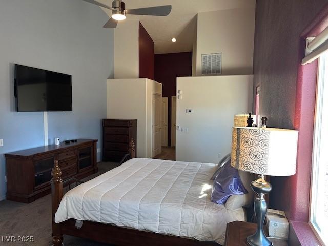 bedroom featuring ceiling fan and carpet