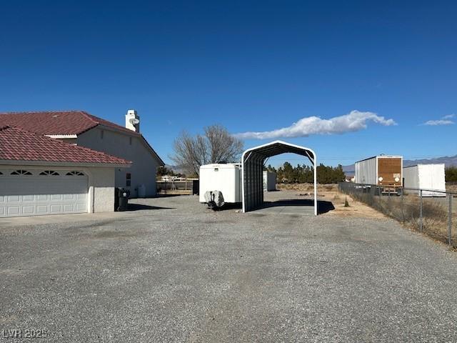 exterior space featuring a carport