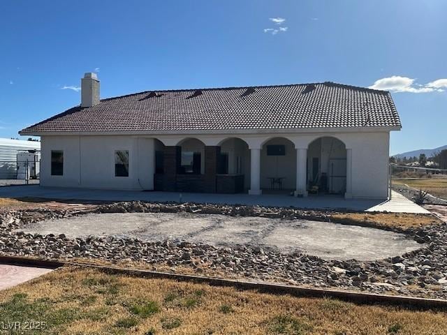 rear view of house featuring a patio