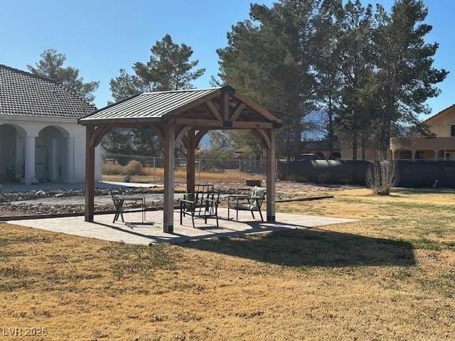 surrounding community featuring a gazebo and a lawn