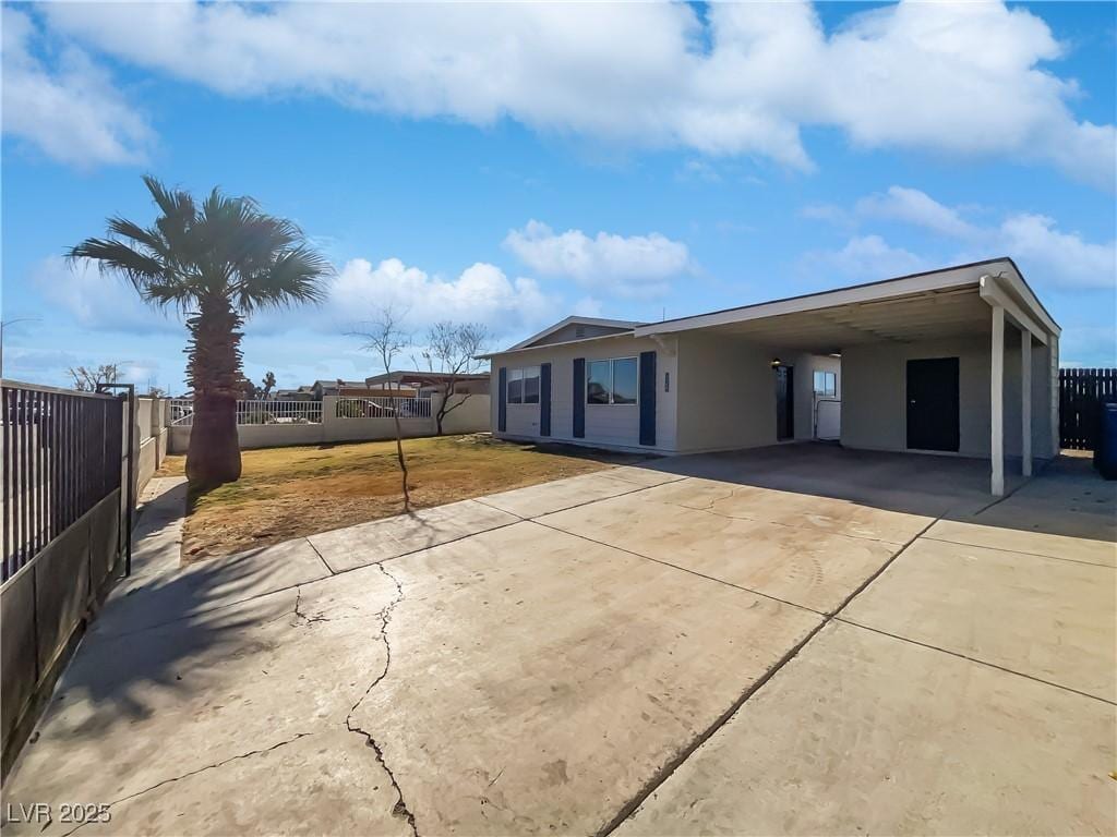 view of side of home featuring a carport