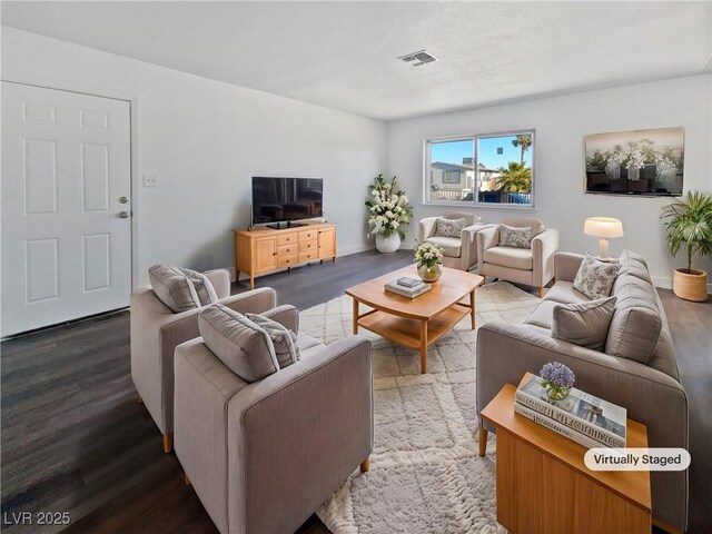 living room with dark hardwood / wood-style floors