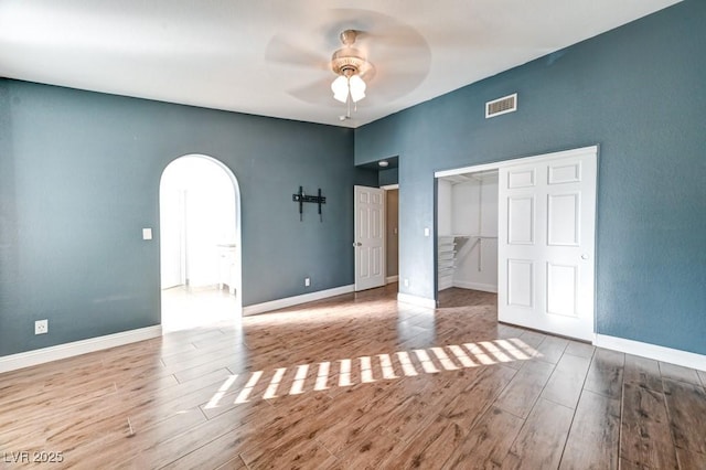 interior space with ceiling fan and light hardwood / wood-style flooring