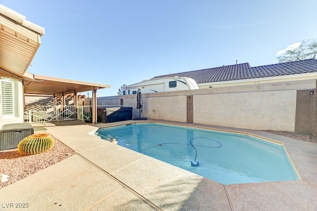 view of swimming pool featuring central AC, a patio, and a hot tub