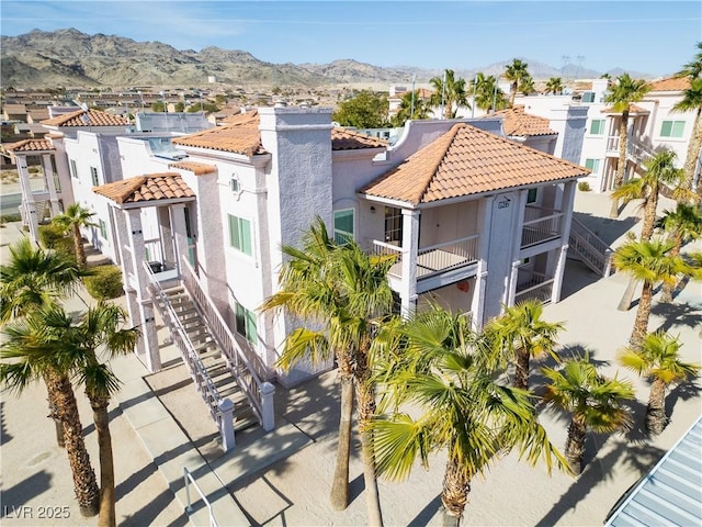 birds eye view of property with a residential view and a mountain view