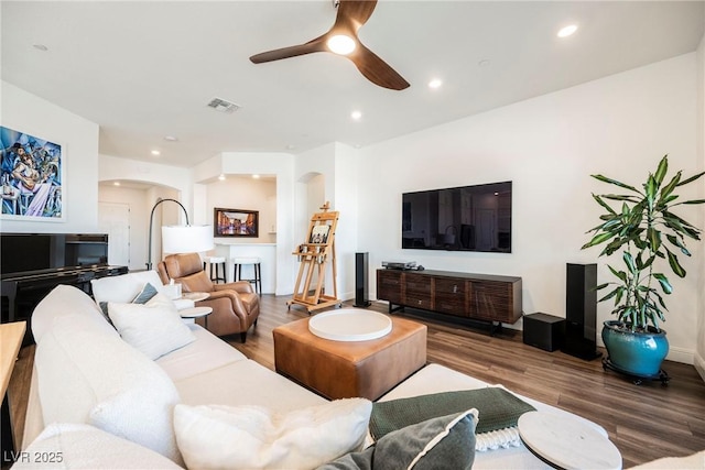 living room with hardwood / wood-style floors and ceiling fan