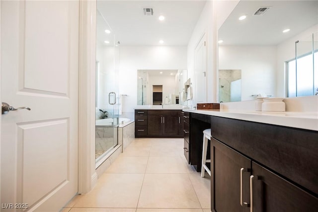 bathroom with separate shower and tub, tile patterned flooring, and vanity