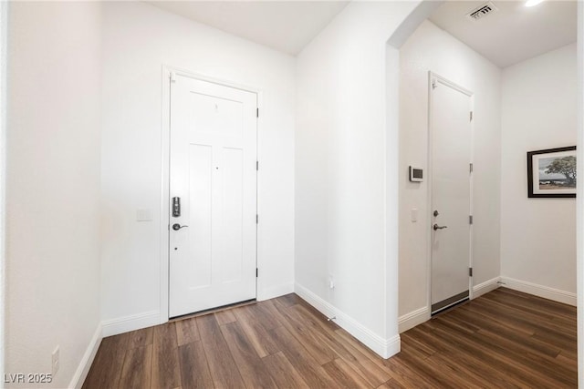 foyer entrance with dark hardwood / wood-style flooring