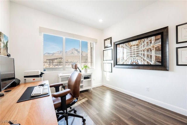 office area with hardwood / wood-style floors and a mountain view