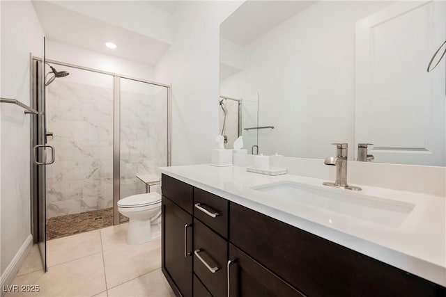 bathroom with toilet, vanity, tile patterned floors, and a shower with shower door