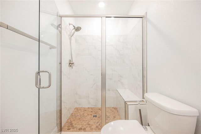 bathroom with toilet and an enclosed shower