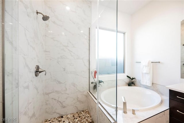 bathroom featuring independent shower and bath and vanity