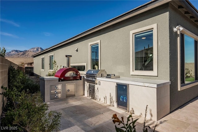 view of patio featuring a mountain view and area for grilling