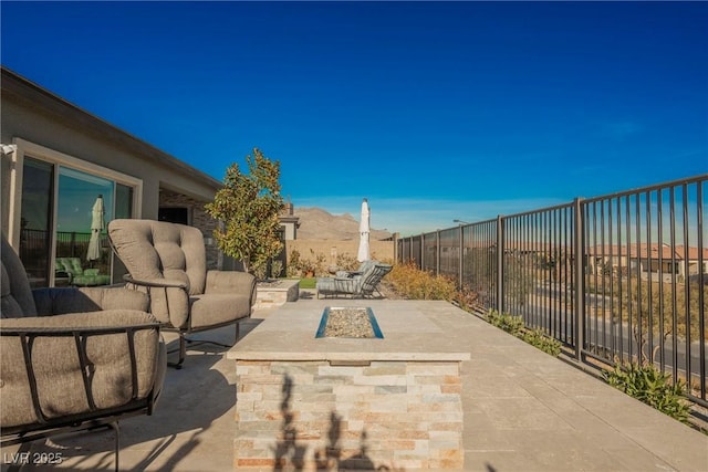 view of patio / terrace with a mountain view