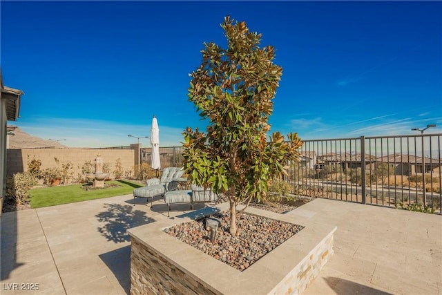 view of patio / terrace featuring an outdoor fire pit