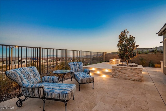 patio terrace at dusk with a fire pit