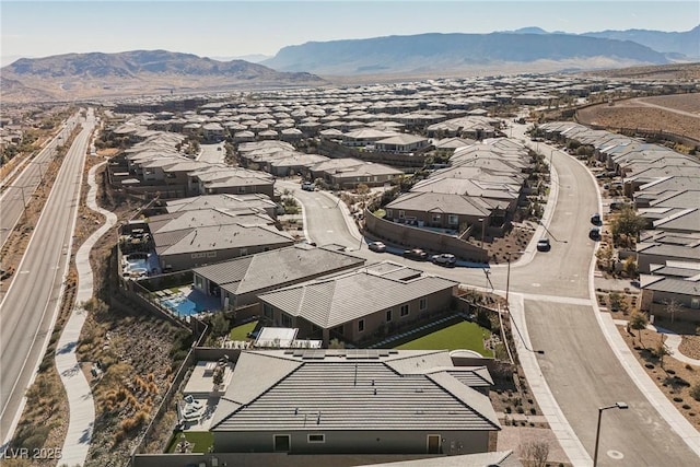 drone / aerial view featuring a mountain view